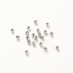 Close-up of diamond-cut 14K gold plated silver beads for DIY jewelry making accessories