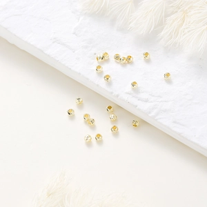 Close-up of 14K gold plated faceted spacer beads for DIY jewelry making and crafts