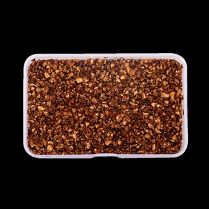 Top view of irregular copper metallic flakes in a clear box for DIY resin and nail art