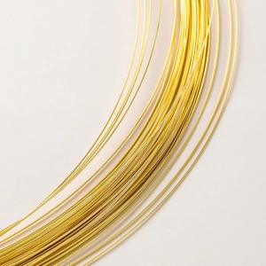 Macro shot of gold-plated copper wire roll for jewelry making and DIY crafts