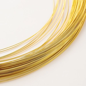 Macro shot of 14K gold filled copper wire showing flexible texture for DIY jewelry making