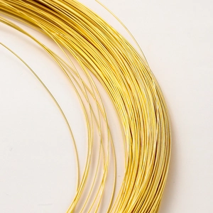 Macro shot of 14K gold-plated jewelry wire roll for DIY handmade necklaces and beads