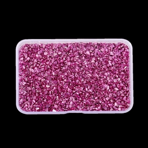 Top view of purple metallic glass crushed stones in a transparent rectangular plastic box