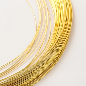 Macro shot of 14K gold-filled copper wire for DIY jewelry making and beading projects