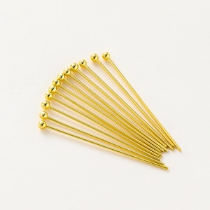 Detailed view of polished 18K gold-plated ball head pins for DIY jewelry making crafts