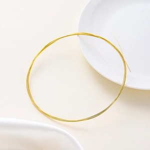 Macro shot of 14K gold-filled jewelry wire for DIY necklace and bracelet crafting