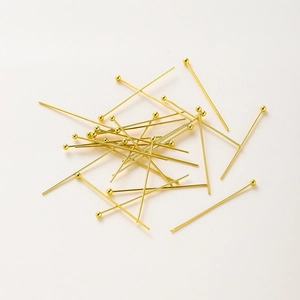 Macro detail of 14K gold plated ball head pins for professional DIY jewelry making