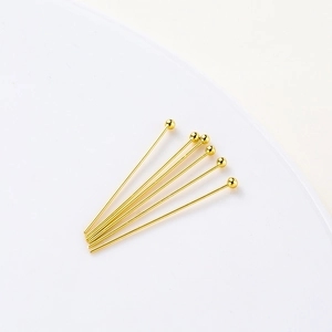 Macro view of six 14K gold plated ball head pins for professional DIY jewelry making