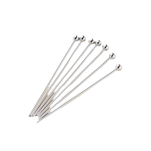 Polished silver metal ball head pins for jewelry making and DIY crafts on white background
