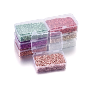 Detail of colorful irregular glass crushed stone set in clear DIY craft storage boxes