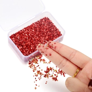 Irregular colorful DIY glass crushed stones in a plastic box for nail art and craft