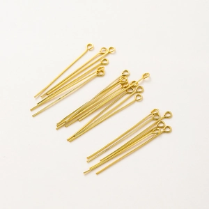 Detailed view of 18K gold-plated eye pins for DIY jewelry making and bead crafts