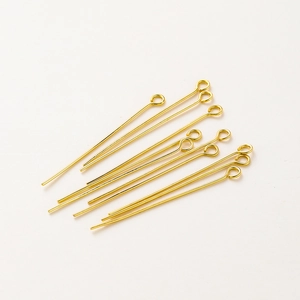 Macro view of 18K gold plated brass eye pins for DIY jewelry making and earring assembly