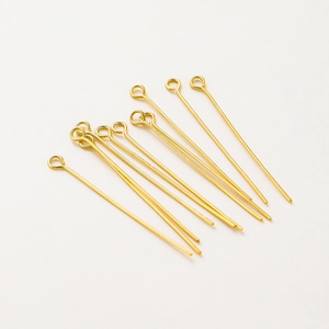 Detailed view of 18K gold plated eye pins for handmade jewelry making and DIY beading