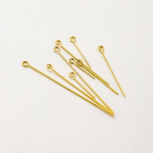 Macro shot of 18K gold plated eye pins for DIY jewelry making with smooth finish