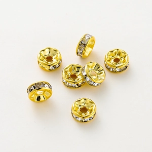 Vista superior de cuentas espaciadoras rondelle bañadas en oro de 14K con cristales de zirconio