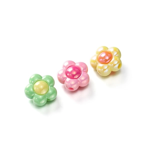 Macro shot of colorful acrylic flower beads with pearlescent finish for DIY jewelry making