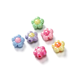 Macro shot of colorful iridescent acrylic flower beads with side holes for DIY jewelry
