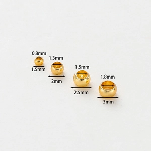Macro view of 14K gold plated stopper beads in four sizes for DIY jewelry making