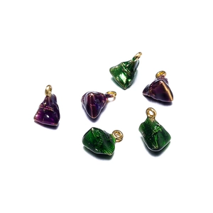 Detailed close-up of green and purple enamel zongzi pendants with gold rings for DIY jewelry