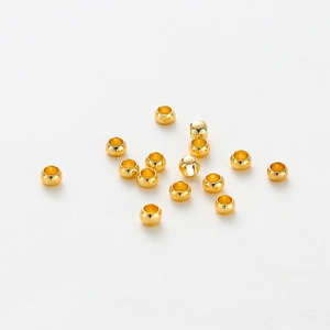 Polished 18K gold plated round spacer beads for DIY jewelry making on white background