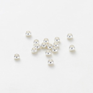 Polished silver spacing beads for DIY jewelry making displayed on a clean white background