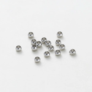 Detailed view of 15 pieces of polished silver spacer beads for DIY jewelry making
