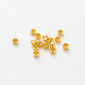Close-up of polished 14K gold plated stopper beads for DIY jewelry making and crafts