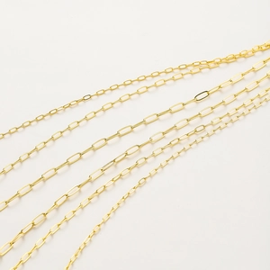 Macro shot of 18K gold plated paperclip chains in various link sizes for DIY jewelry