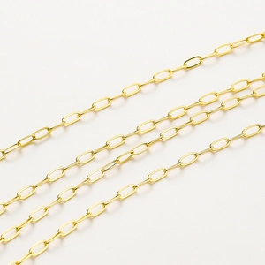Macro detail of 18K gold-plated oval paperclip chain links for DIY jewelry making