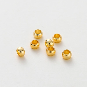 Close-up of 14K gold plated stopper beads for DIY jewelry making with high polish finish