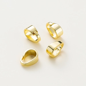 Macro shot of four 14K gold plated pendant pinch bails for DIY jewelry making