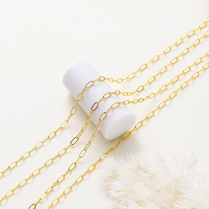 Detailed view of 18K gold-plated paperclip chain links with a high-shine polished finish