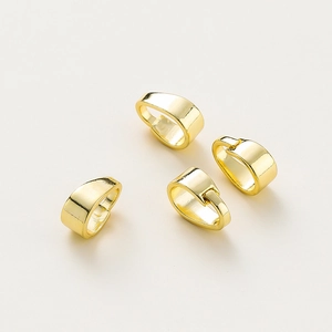 Macro shot of 4 pieces of gold-plated S925 sterling silver pinch bails for DIY jewelry