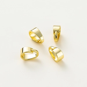 Macro view of four 14K gold plated jewelry pinch bails for DIY necklace pendants
