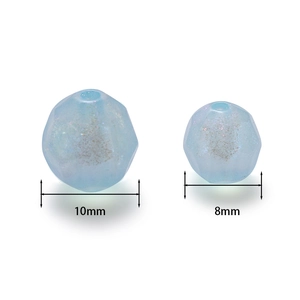 Detail of light blue pearlescent acrylic star beads in 10mm and 8mm sizes for DIY crafts