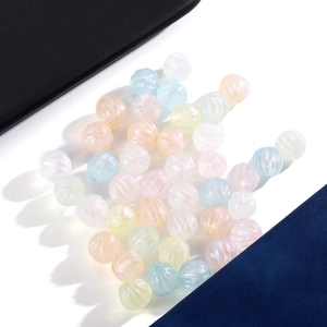 Macro detail of ribbed acrylic jelly beads with iridescent pearl finish for DIY jewelry