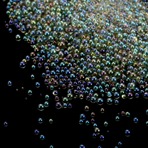 Macro shot of 20g iridescent bubble glass beads for DIY crafts and nail art decor