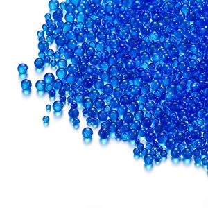 Macro view of blue translucent glass bubble beads for DIY nail art and decorations