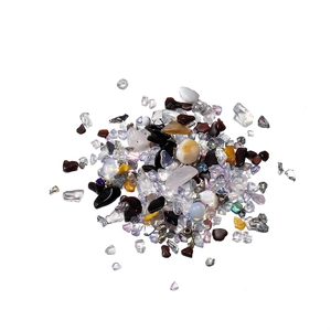 Macro shot of colorful irregular crushed glass and crystal stones for DIY nail art fillers