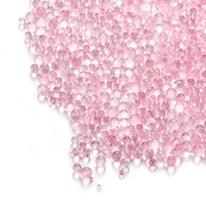 Macro shot of iridescent pink bubble beads for DIY jewelry and nail art decoration