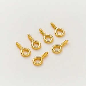 Detailed view of six 14K gold-plated screw eye pins for DIY jewelry pendant making