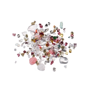 Close-up of mixed iridescent irregular crystal glass beads for DIY nail art and crafts