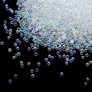 Macro shot of iridescent aurora caviar beads for DIY nail art on black background