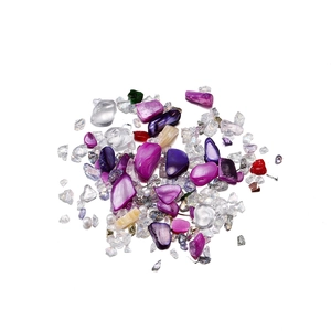 Detailed view of colorful irregular crystal glass sand for DIY nail art and fillers