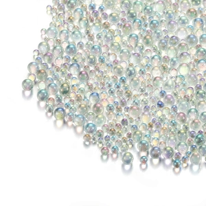 Macro shot of iridescent mermaid glass micro beads for nail art and DIY crafts