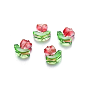DIY glass tulip beads with red petals and green leaves featuring sparkling gold glitter