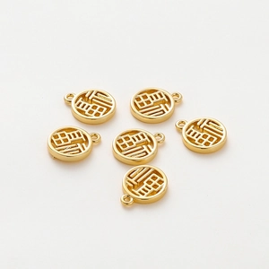 Detailed view of 6 pieces 18K gold plated Fu character round hollow charms for DIY jewelry