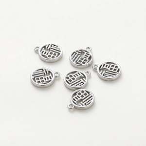 Macro shot of 6 silver Fu pendants with hollow character design for DIY jewelry