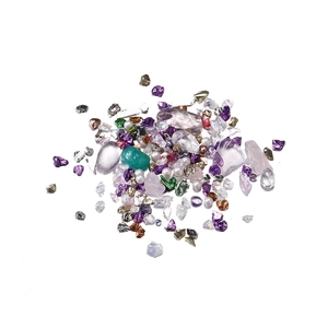 Close-up of colorful mixed crystal glass gravel and pearls for DIY nail art and crafts